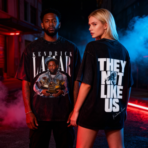 Black man and white woman wearing Not Like Us hip-hop T-shirts inspired by Kendrick Lamar, standing under red and blue lights.